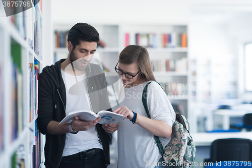 Image of students couple  in school  library