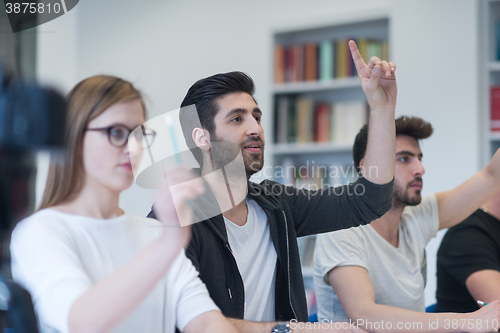 Image of group of students study together in classroom