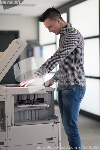 Image of young  business man copy documents