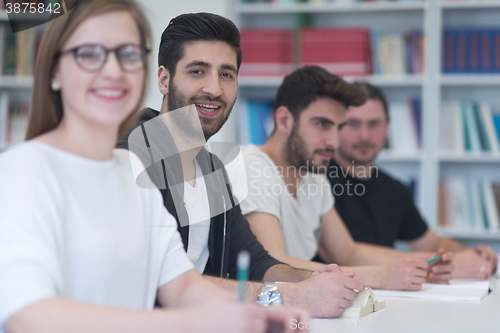 Image of group of students study together in classroom