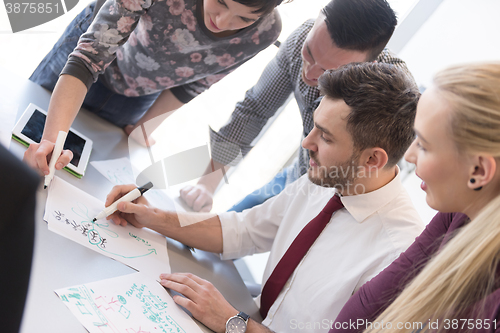 Image of young business people group on meeting at modern office