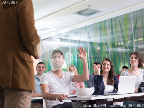 Image of close up of teacher hand while teaching in classroom