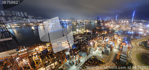 Image of Cargo ship and crane at port reflect on sea bay,