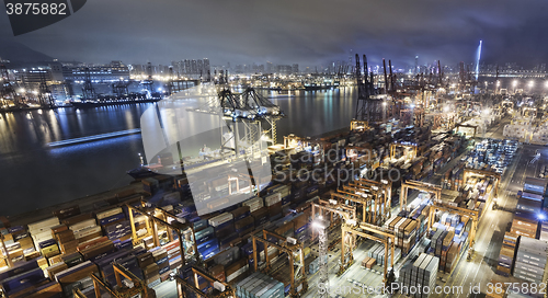 Image of Cargo ship and crane at port reflect on sea bay,