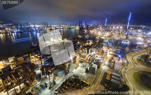 Image of Cargo ship and crane at port reflect on sea bay,
