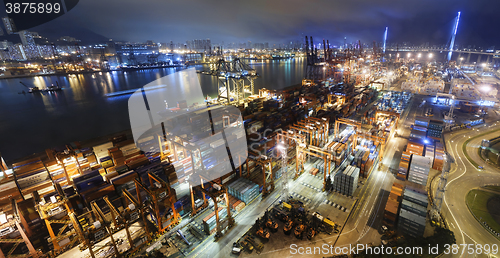 Image of Cargo ship and crane at port reflect on sea bay,