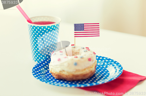 Image of donut with juice and american flag decoration