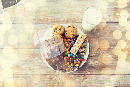 Image of close up of sweet food and milk glass on table