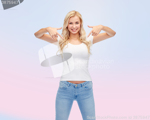 Image of happy young woman or teenage girl in white t-shirt