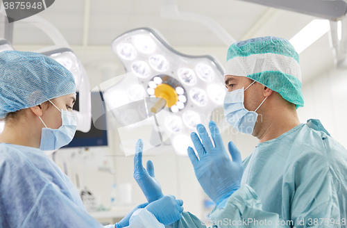 Image of surgeons in operating room at hospital