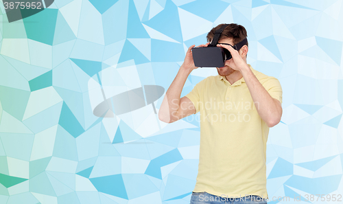 Image of happy man in virtual reality headset or 3d glasses