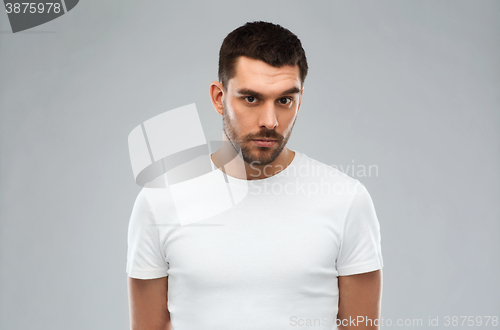 Image of young man portrait over gray background