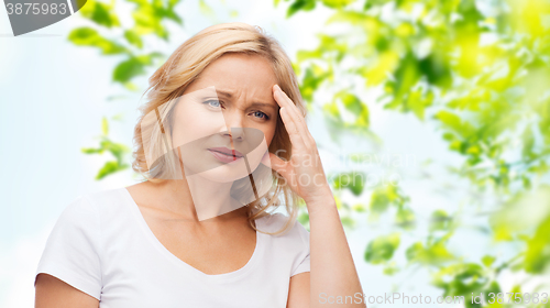 Image of unhappy woman suffering from headache