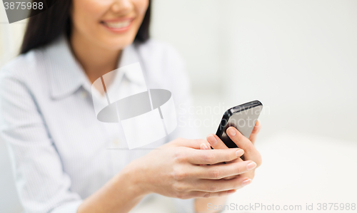 Image of close up of woman texting on smartphone