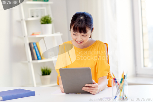 Image of asian woman student with tablet pc at home
