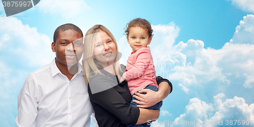 Image of happy multiracial family with little child