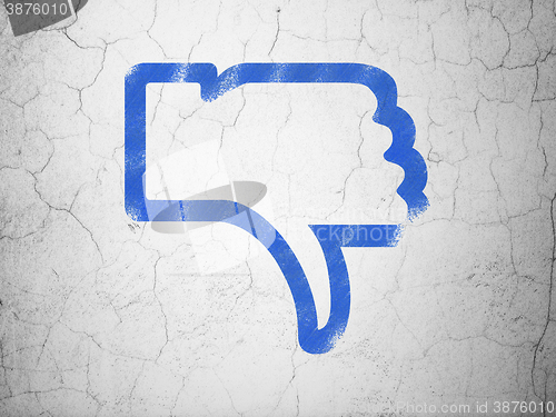 Image of Social network concept: Thumb Down on wall background