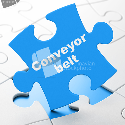 Image of Manufacuring concept: Conveyor Belt on puzzle background