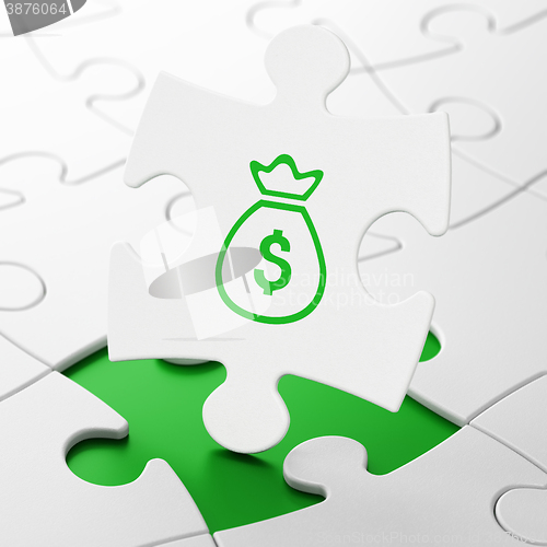 Image of Banking concept: Money Bag on puzzle background
