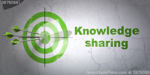 Image of Learning concept: target and Knowledge Sharing on wall background