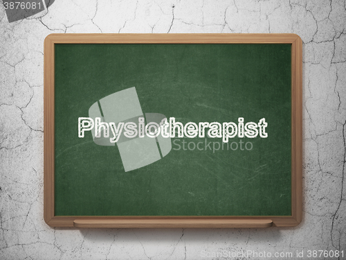 Image of Medicine concept: Physiotherapist on chalkboard background