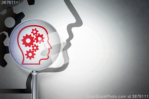 Image of Education concept:  Head With Gears with optical glass on digital background