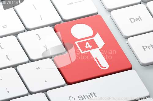 Image of News concept: Microphone on computer keyboard background