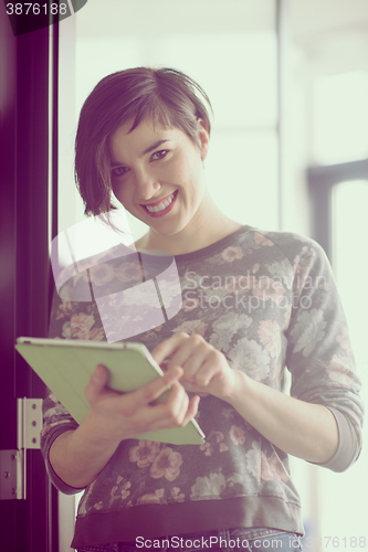 Image of business woman working on tablet