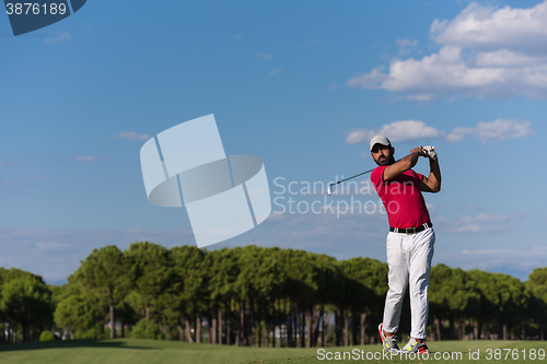 Image of golf player hitting long shot