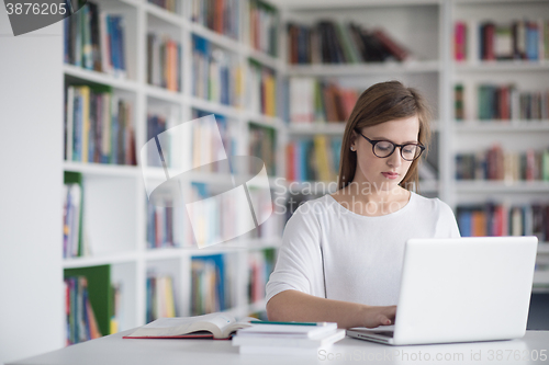 Image of female student study in school library