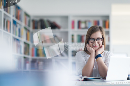 Image of female student study in school library