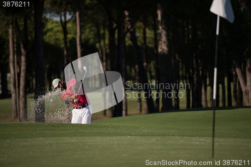 Image of golfer hitting a sand bunker shot