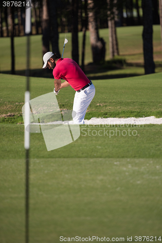 Image of golfer hitting a sand bunker shot