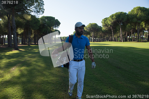 Image of golf player walking