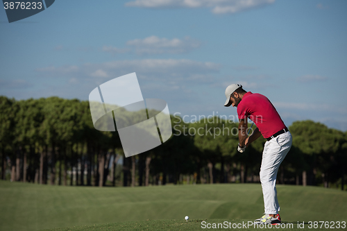 Image of golf player hitting long shot
