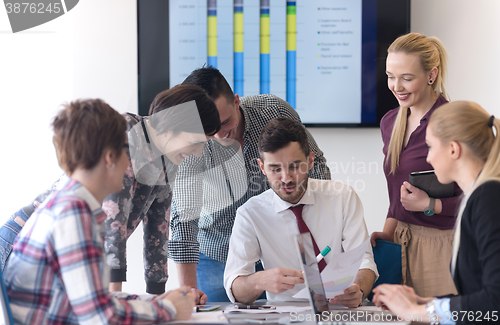 Image of young business people group on meeting at modern office