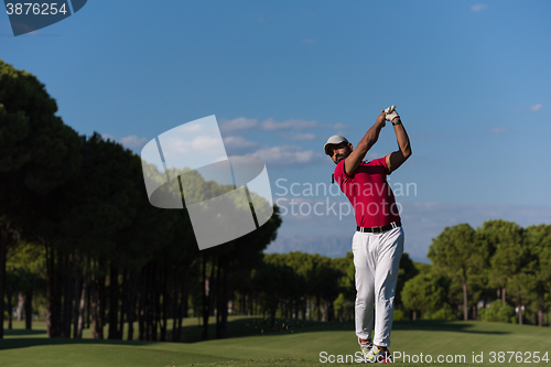 Image of golf player hitting long shot