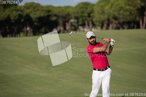 Image of golfer hitting a sand bunker shot