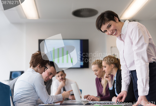 Image of young  woman using  tablet on business meeting