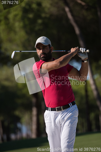 Image of golfer hitting a sand bunker shot