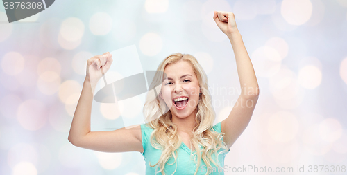 Image of happy young woman or teen girl celebrating victory