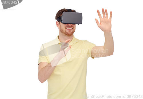 Image of happy man in virtual reality headset or 3d glasses