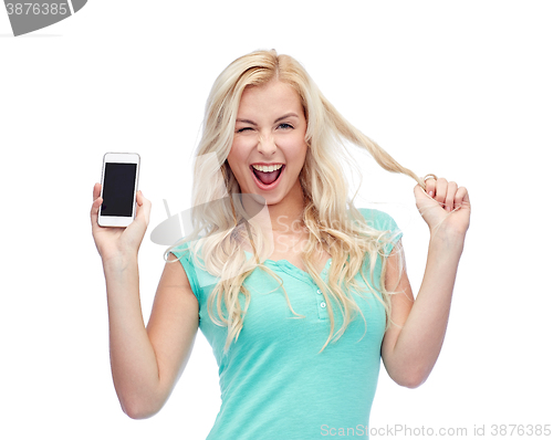 Image of happy young woman or teenage girl with smartphone