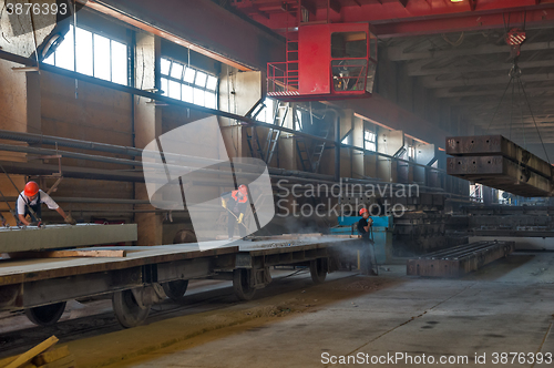 Image of Worker cleans railway platform