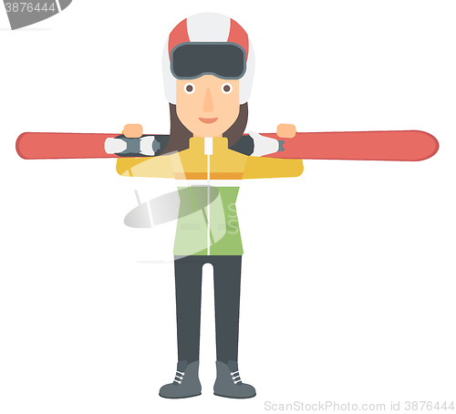 Image of Woman holding skis.