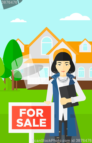 Image of Real estate agent offering house.