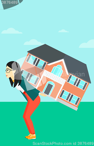 Image of Woman carrying house.