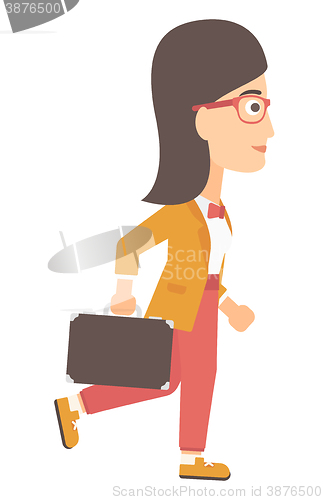 Image of Business woman walking with briefcase. 