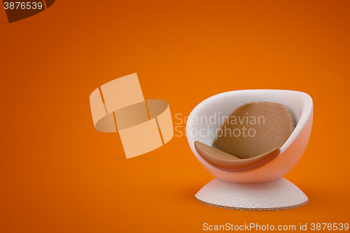 Image of armchair in an orange room