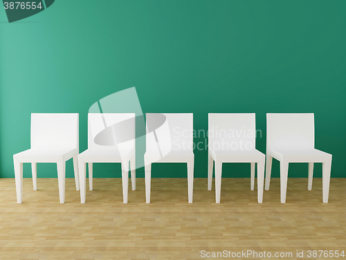 Image of five white chairs